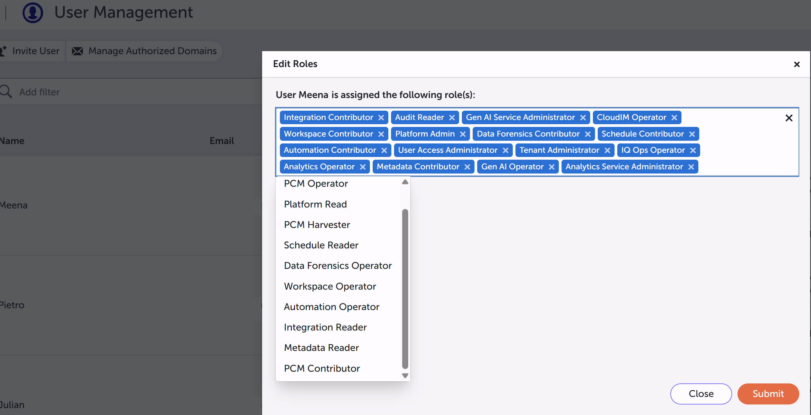 Edit Roles dialog showing multiple assigned granular roles and the role picker dropdown for an existing user.